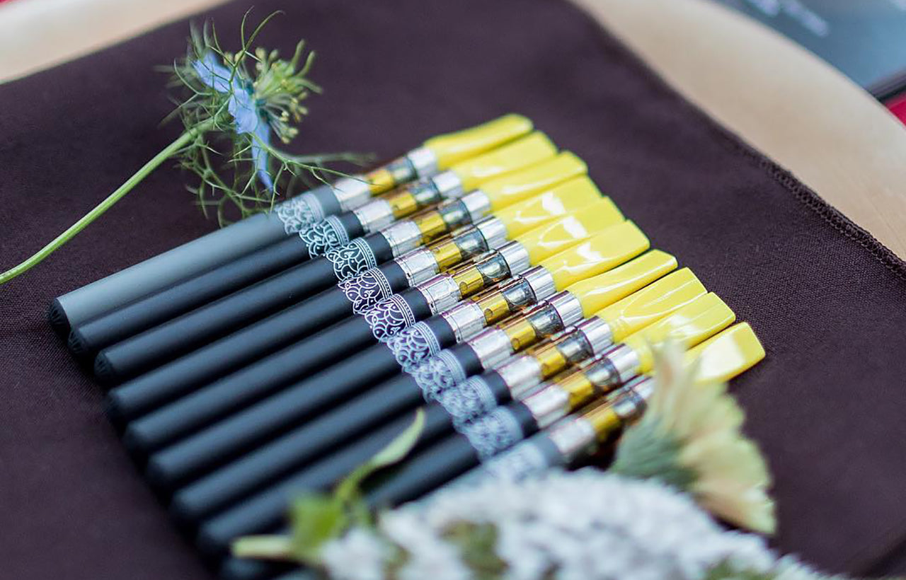 A row of weed vape pens, image courtesy of The Herbsomm on Instagram