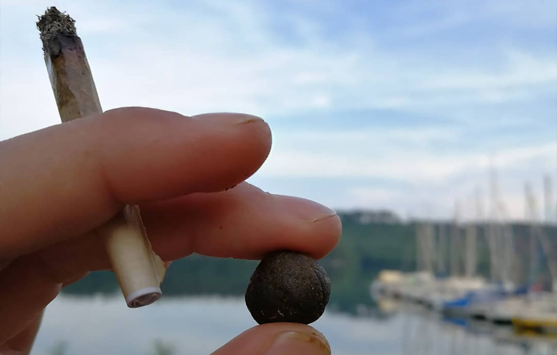 A hash ball held with the same hand as another smokeable, image from Hashseur on Instagram